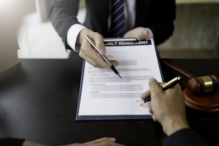 a lawyer advising on bankruptcy paperwork.