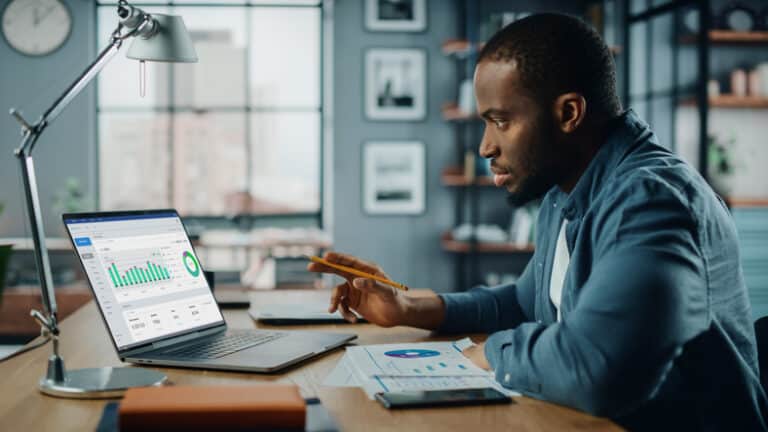 a man on his laptop dealing with collection agencies