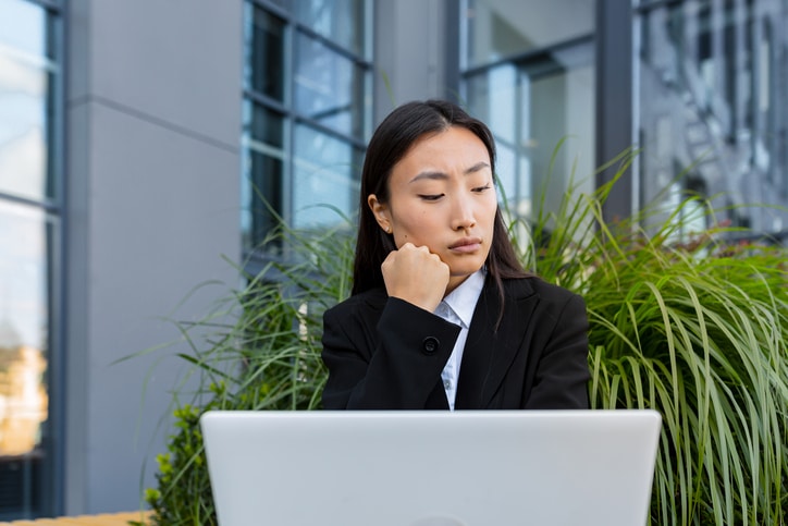 a woman on her laptop reading tips on bankruptcy
