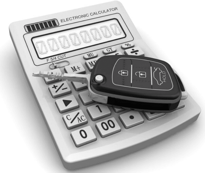 keys laying on top of a calculator