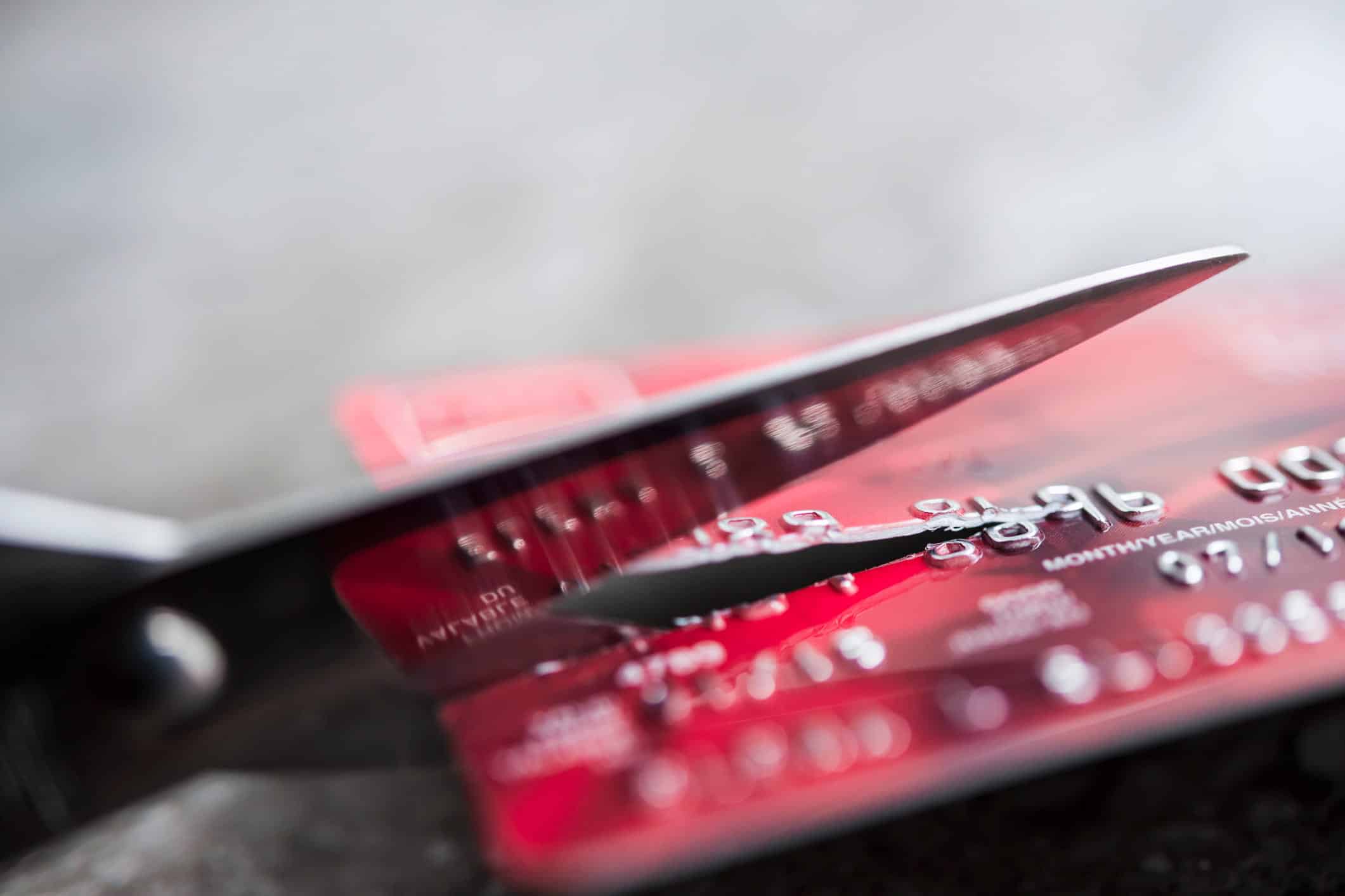 credit card being cut up by scissors