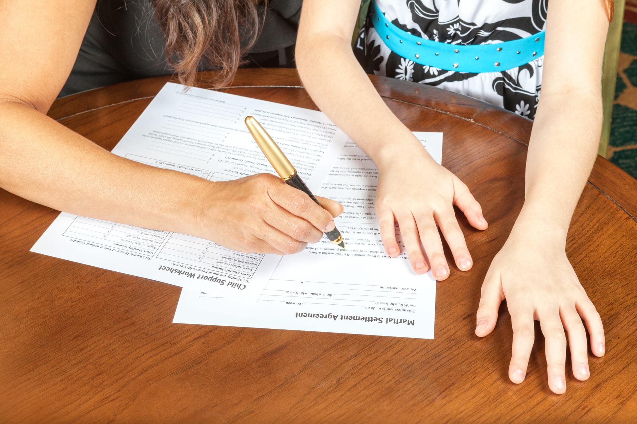 parent filling out child support forms