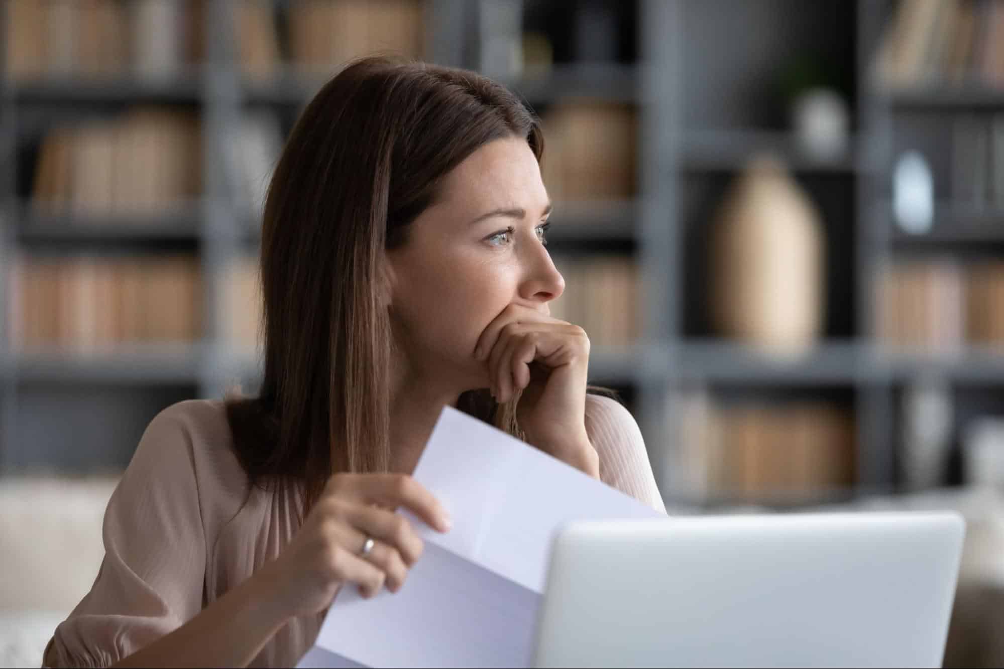 woman thinking about if she should file bankruptcy with an attorney