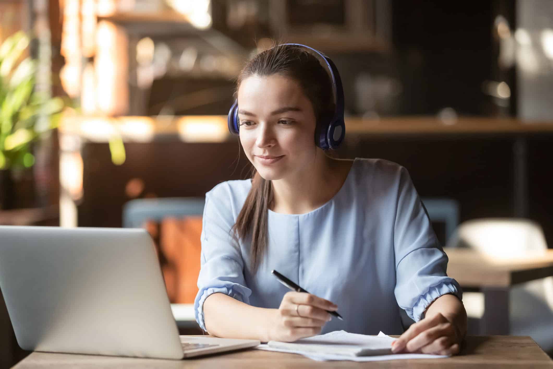 woman completing a credit course on her laptop