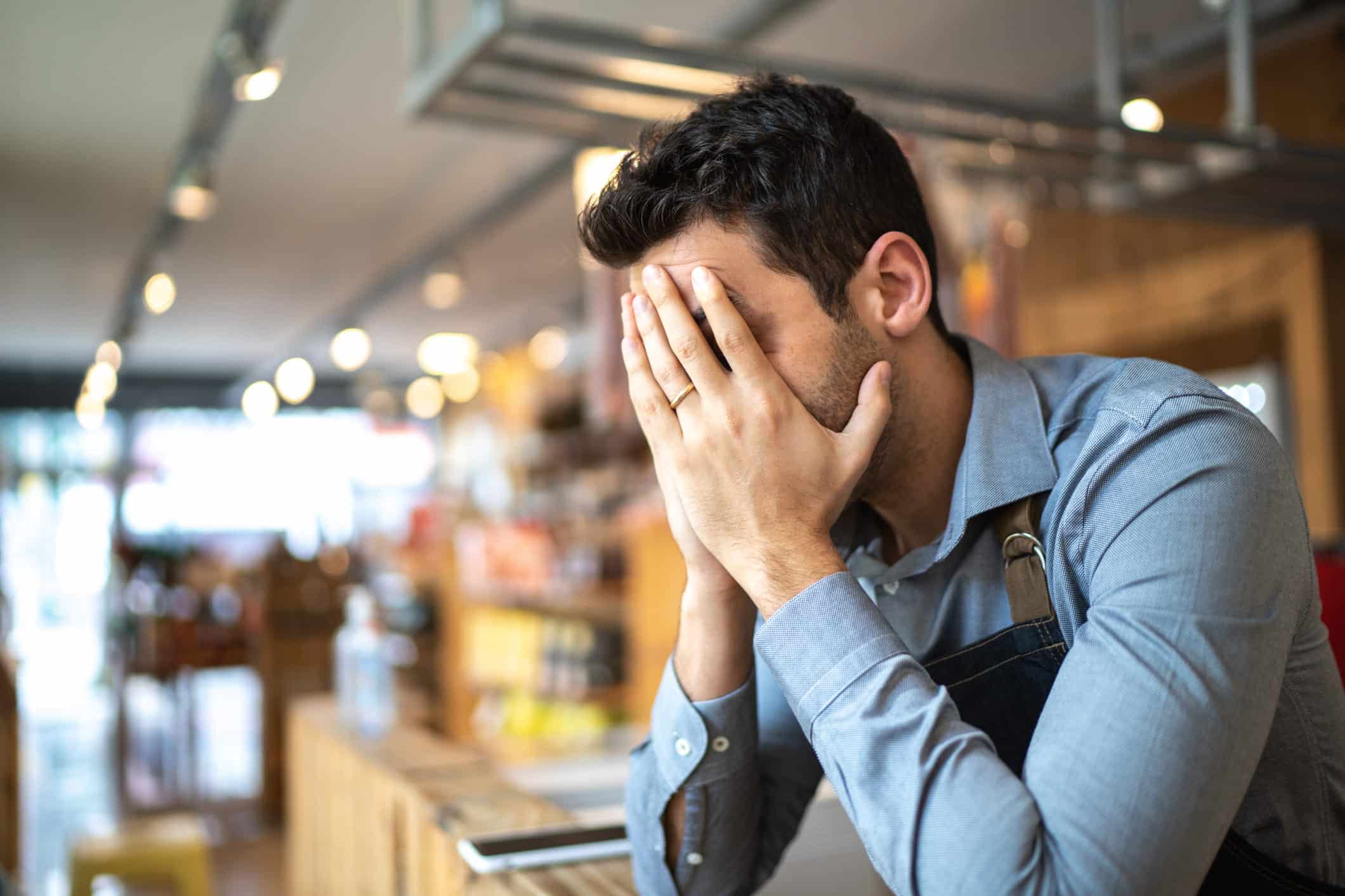 worried man with hands on his face