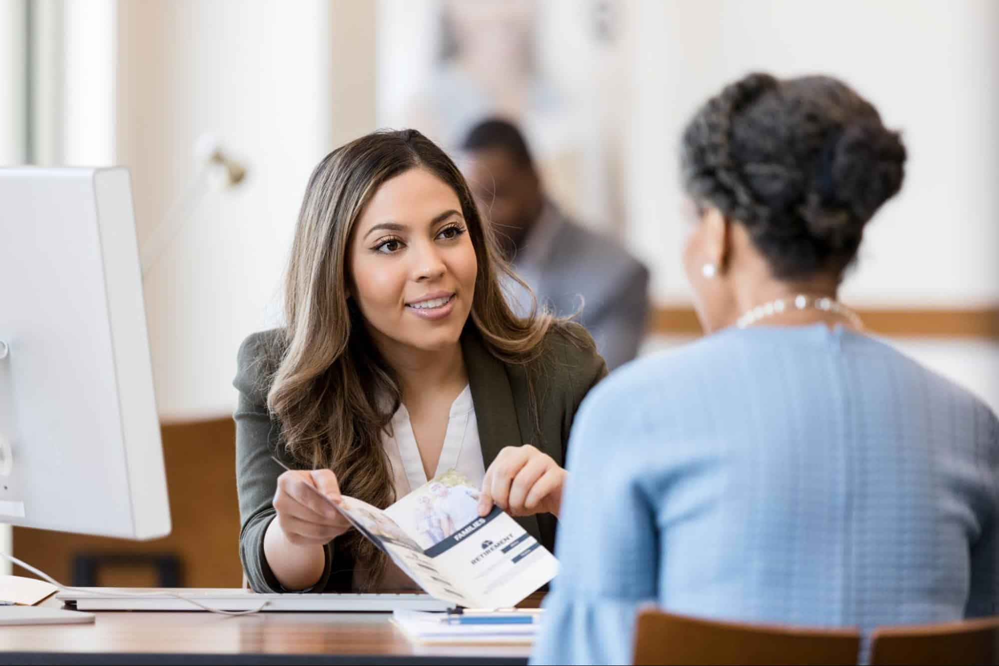 credit union associate speaking to client