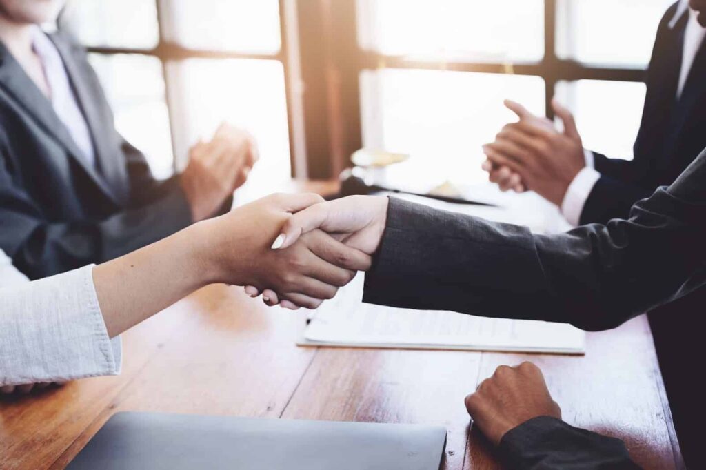 lawyers shaking hands with clients