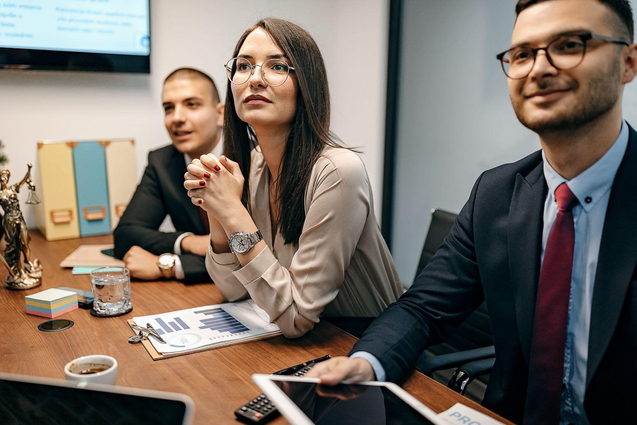 three credit card debt lawyers sitting table