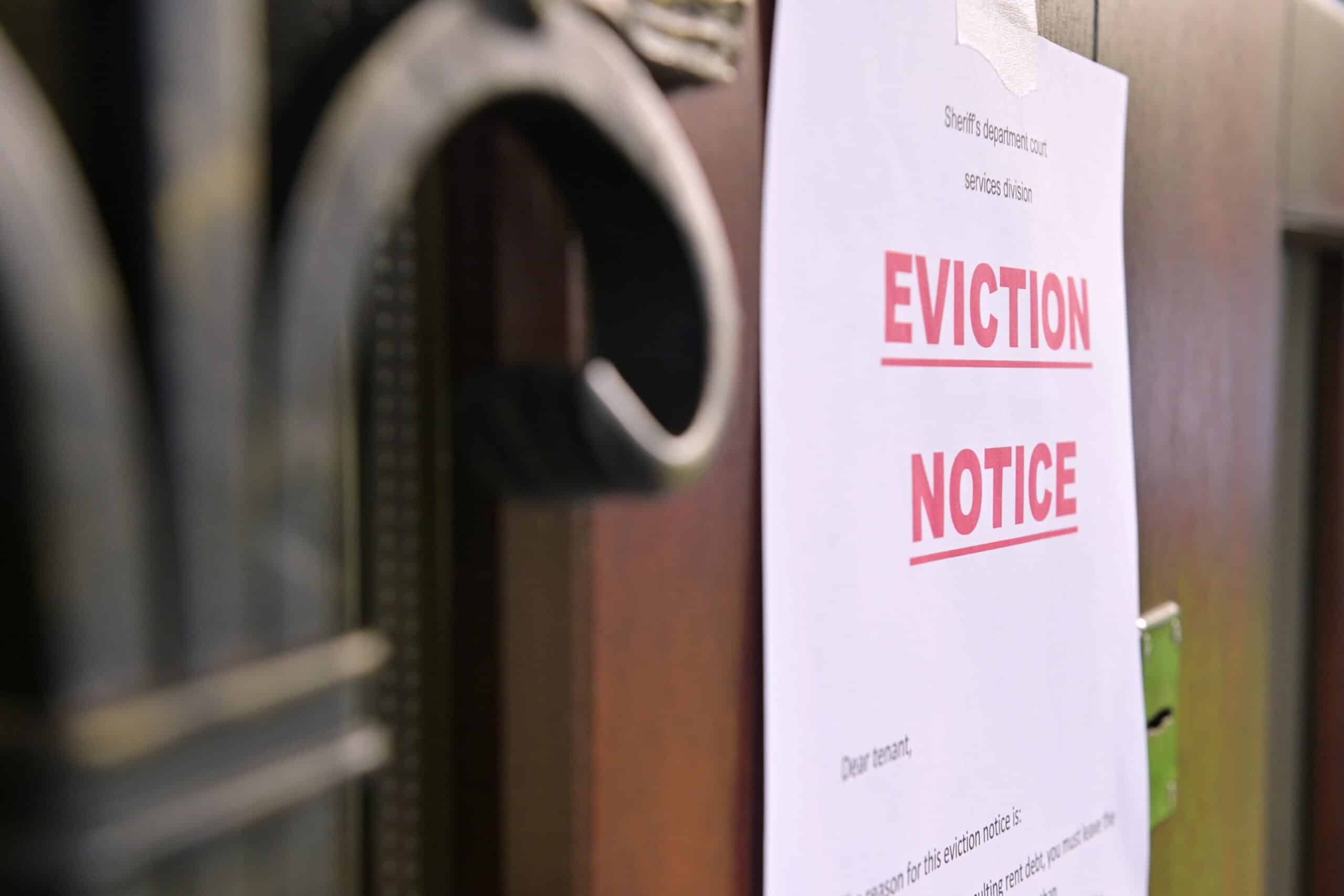 eviction notice posted on front of a building