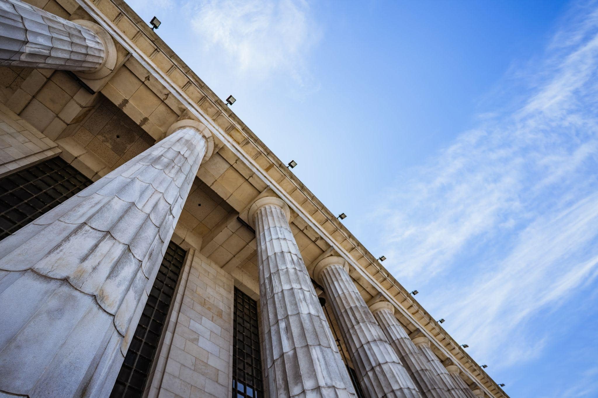 image of court house with pillars at an upward angel