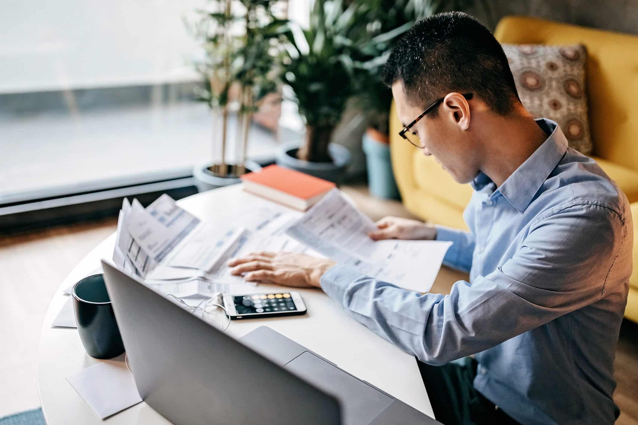 person who is filing for bankruptcy looking at documents