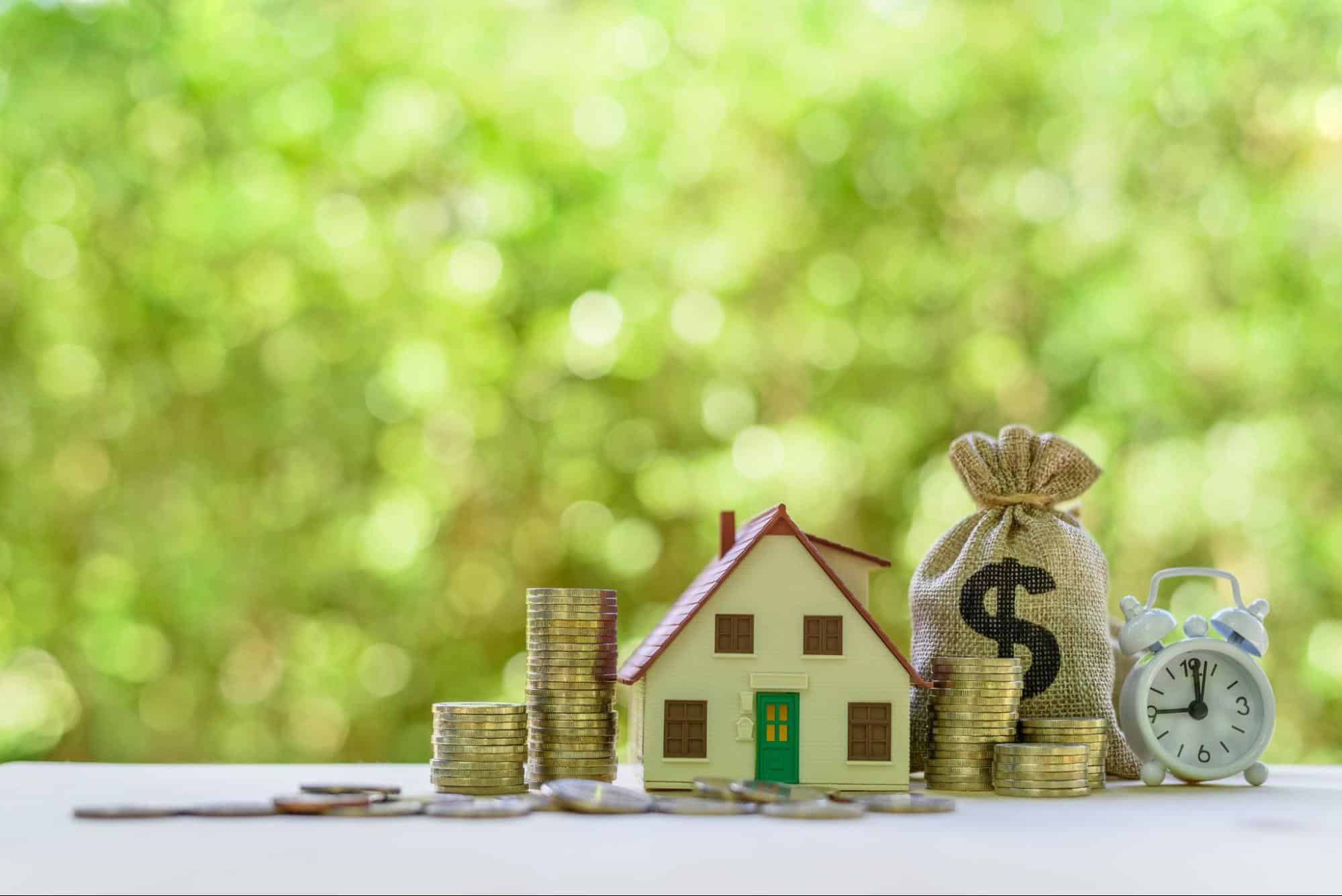 house model and coins 