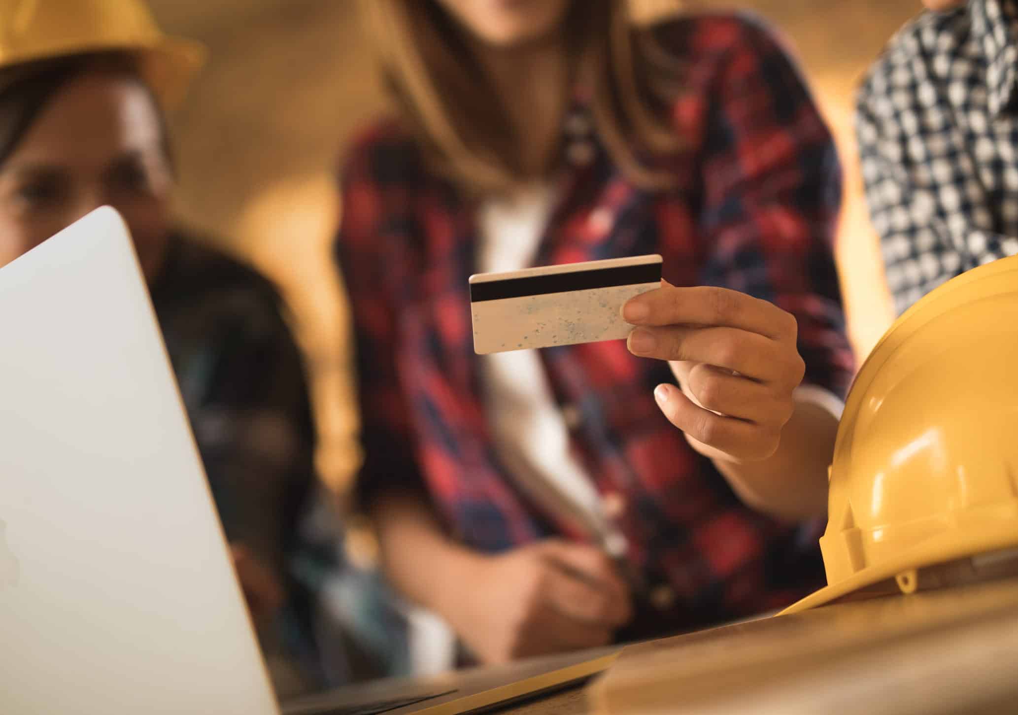 2 people looking at a credit card