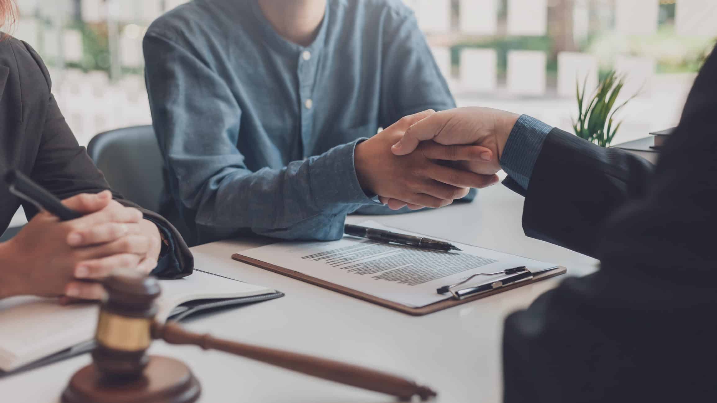 bankruptcy attorney shaking the hand of a client