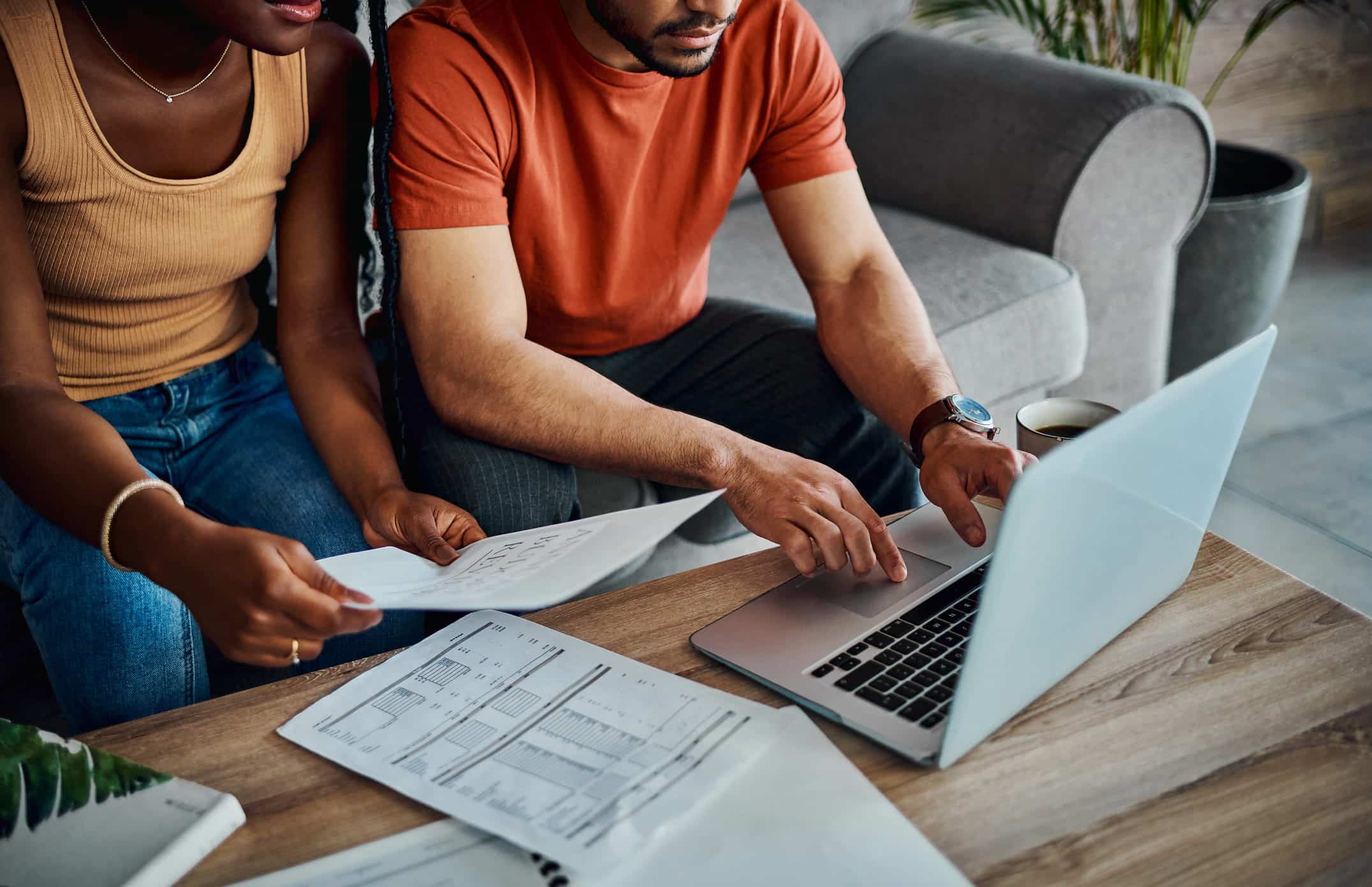 couple who is filing for taxes on a laptop