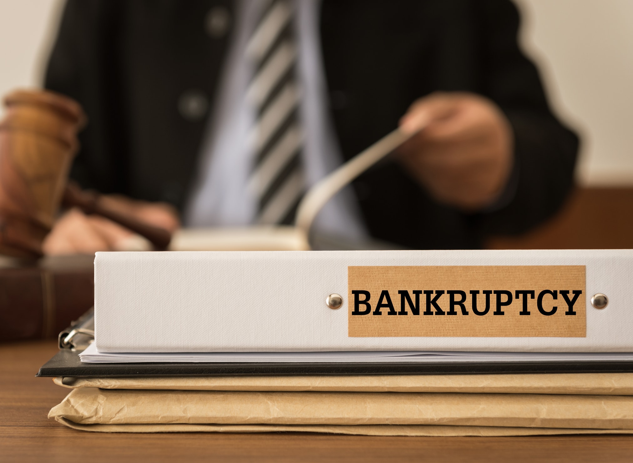 bankruptcy attorney with a bankruptcy folder on his desk