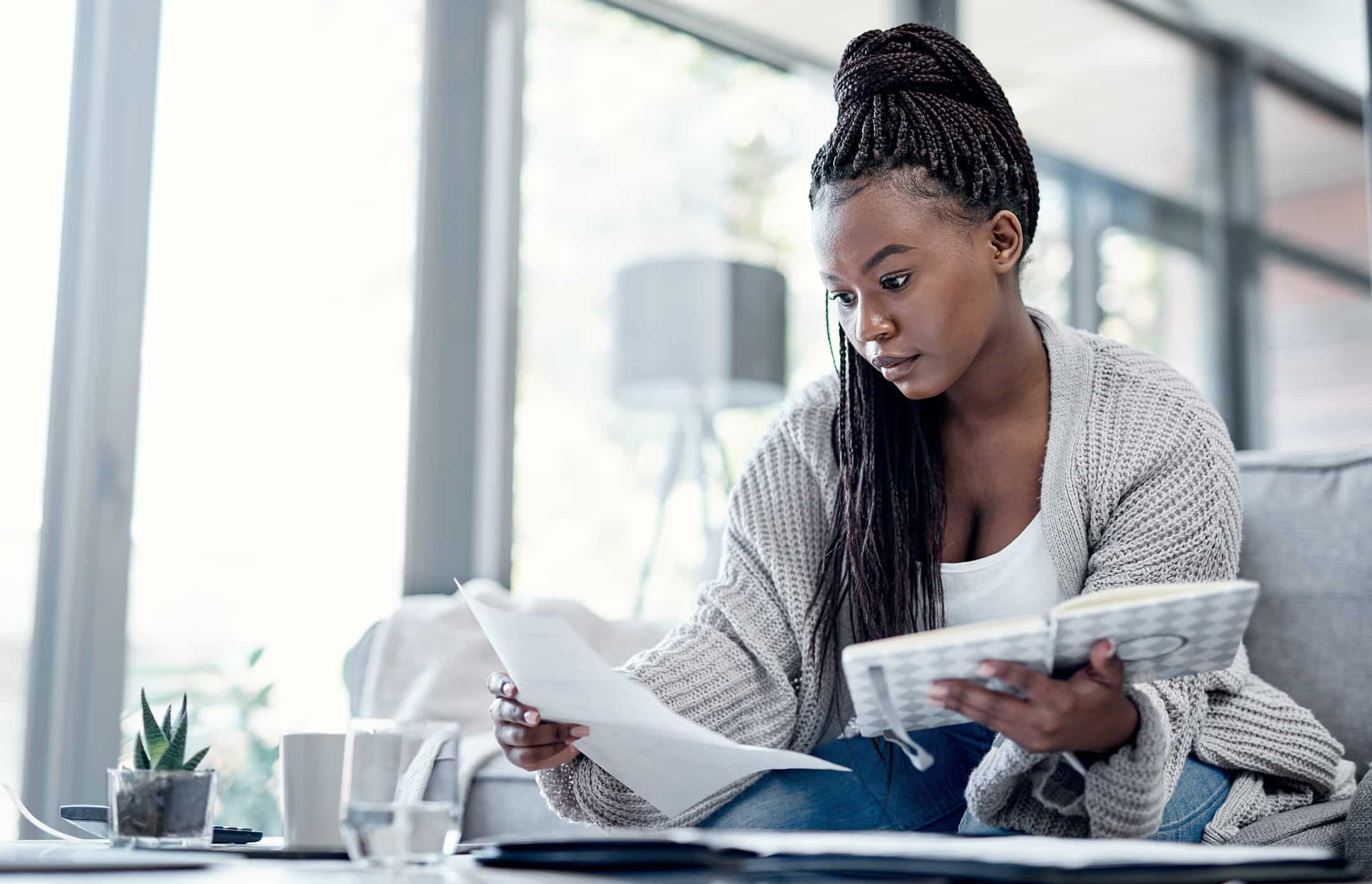 woman looking at student loan documents