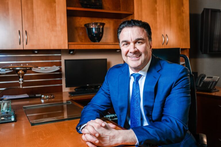 anthony deluca las vegas bankruptcy lawyer sitting down in his office and smiling