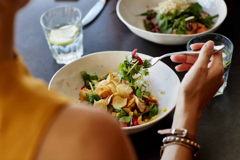 person having a salad for lunch